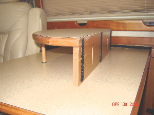 Photo showing back side of add-on coffee table showing Velcro strips